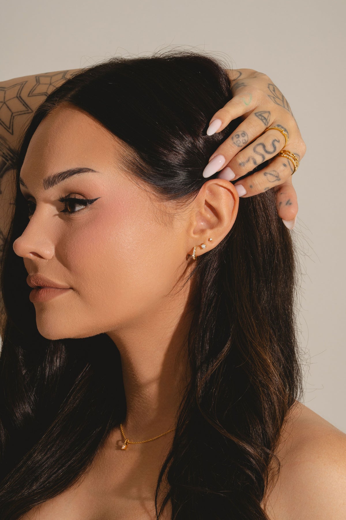 Mini diamond studs in gold vermeil on Talia Mar