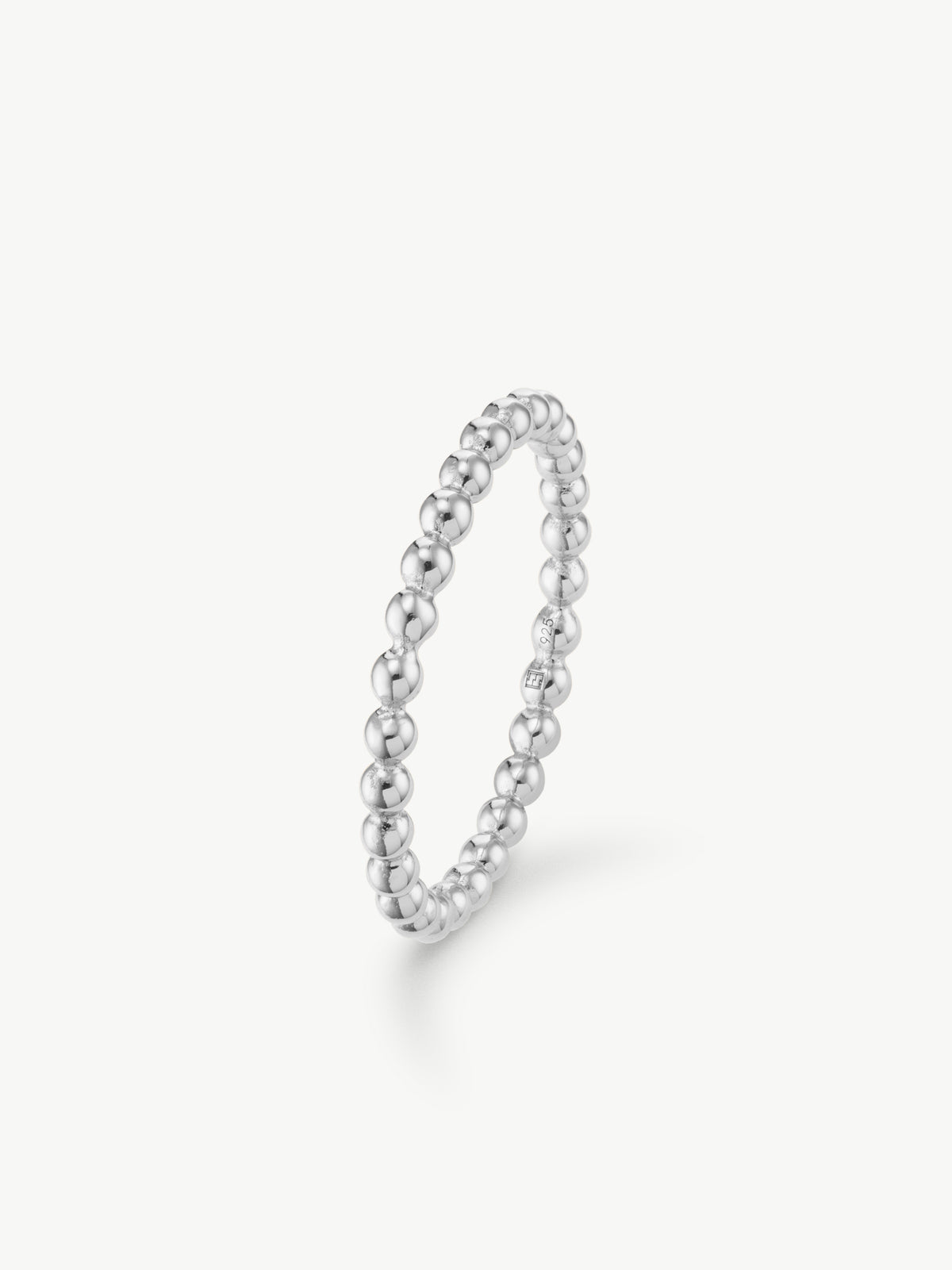 silver ring with beaded design